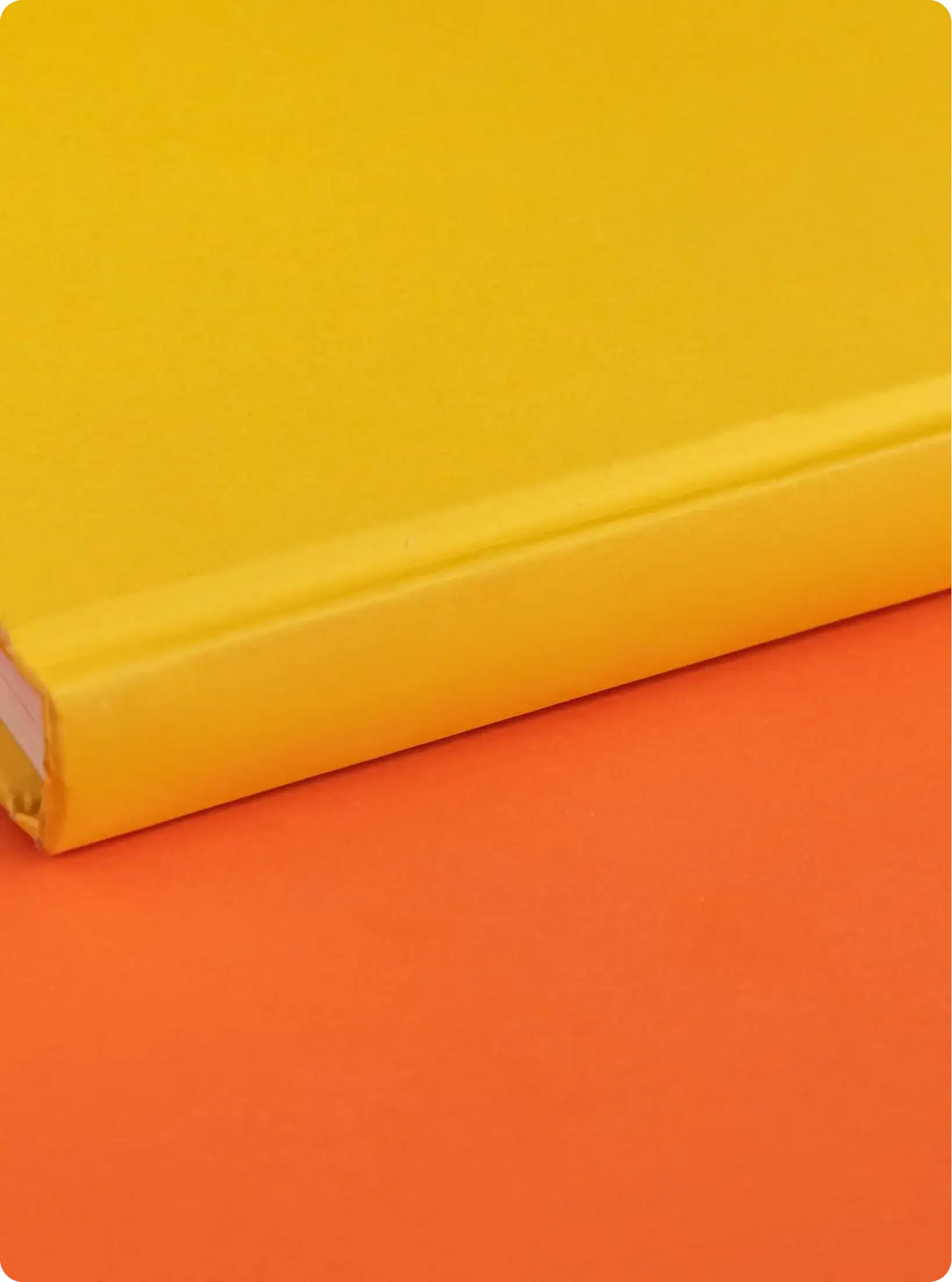 A yellow hardback lying on an orange ground