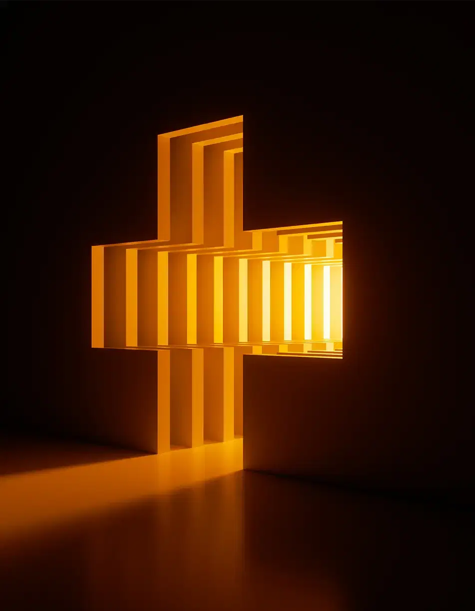 A cross of light cut into a dark wall