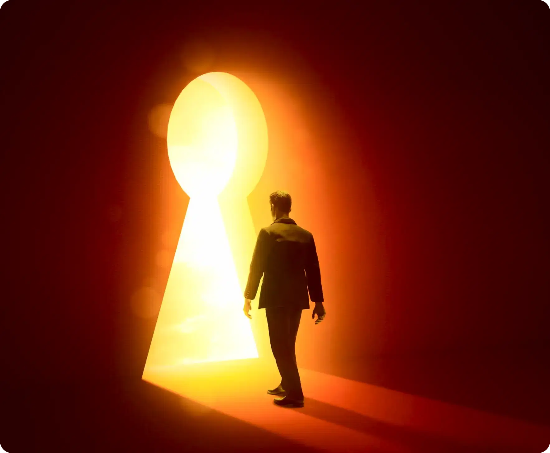 A figure walking towards a lit keyhole-shaped doorway