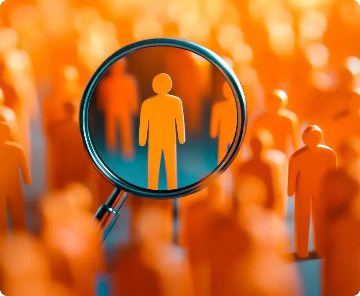 A magnifying glass picking one figure out of a crowd